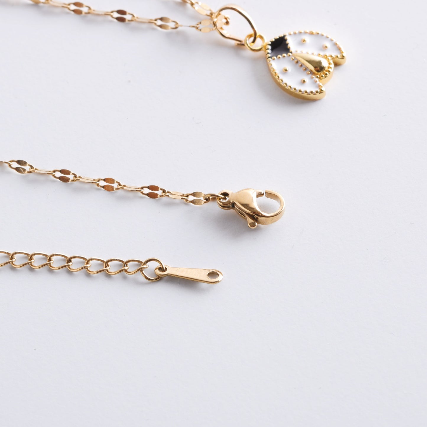 White Lady Bug Necklace In Gold