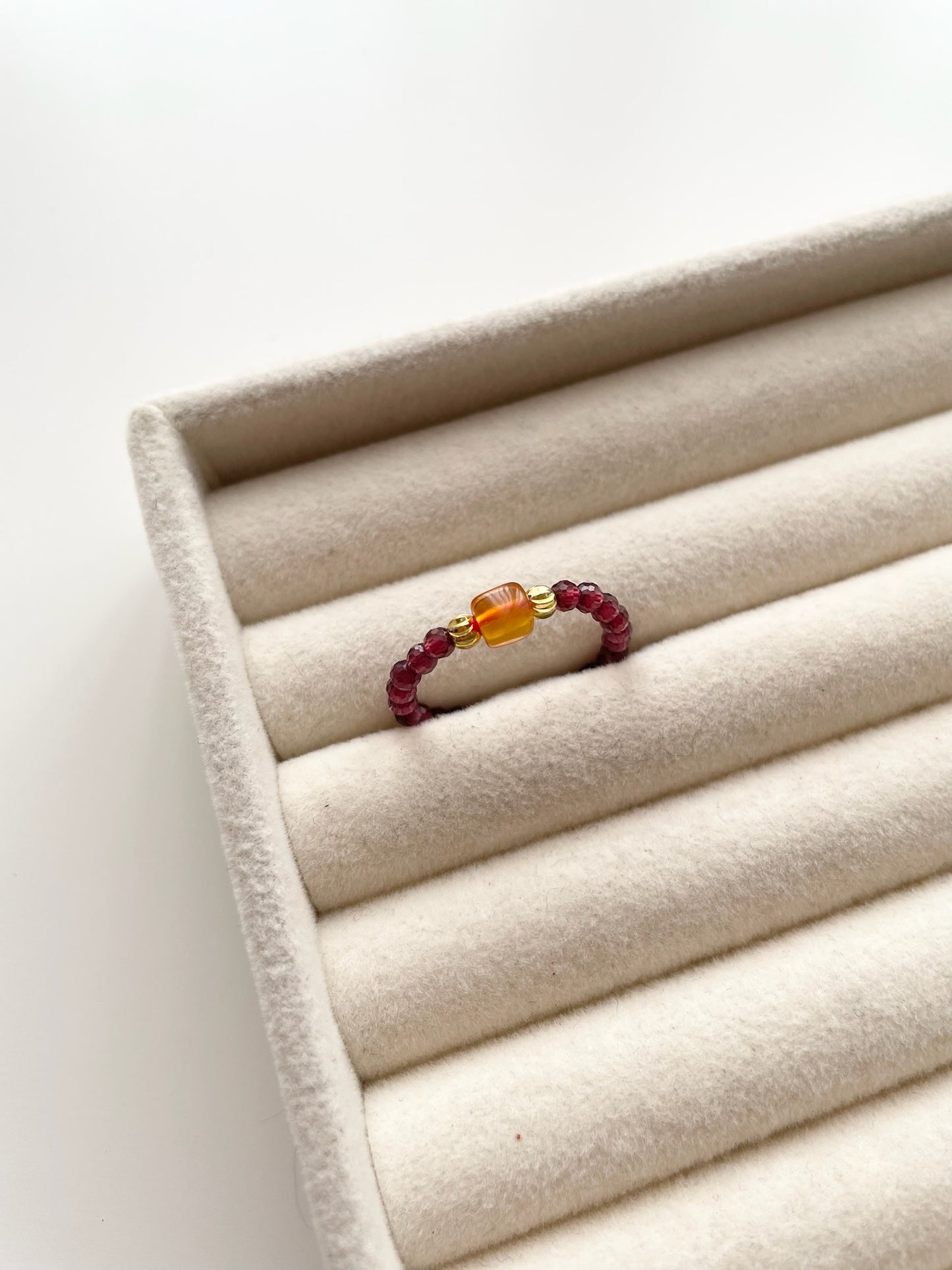 gring3 Garnet ring with amber